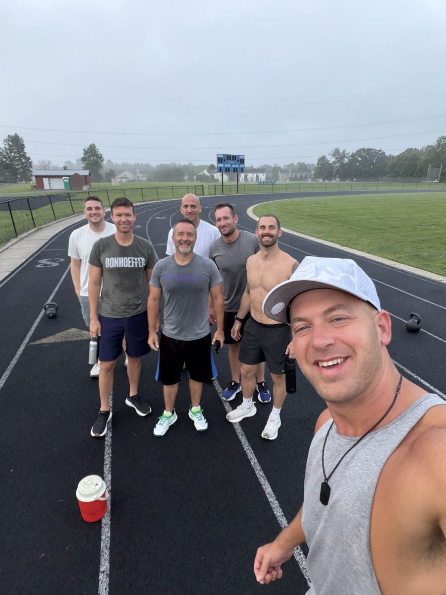 The group standing in lane one at dawn